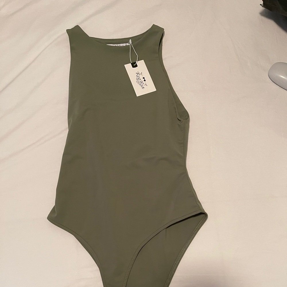 Body suit with tags